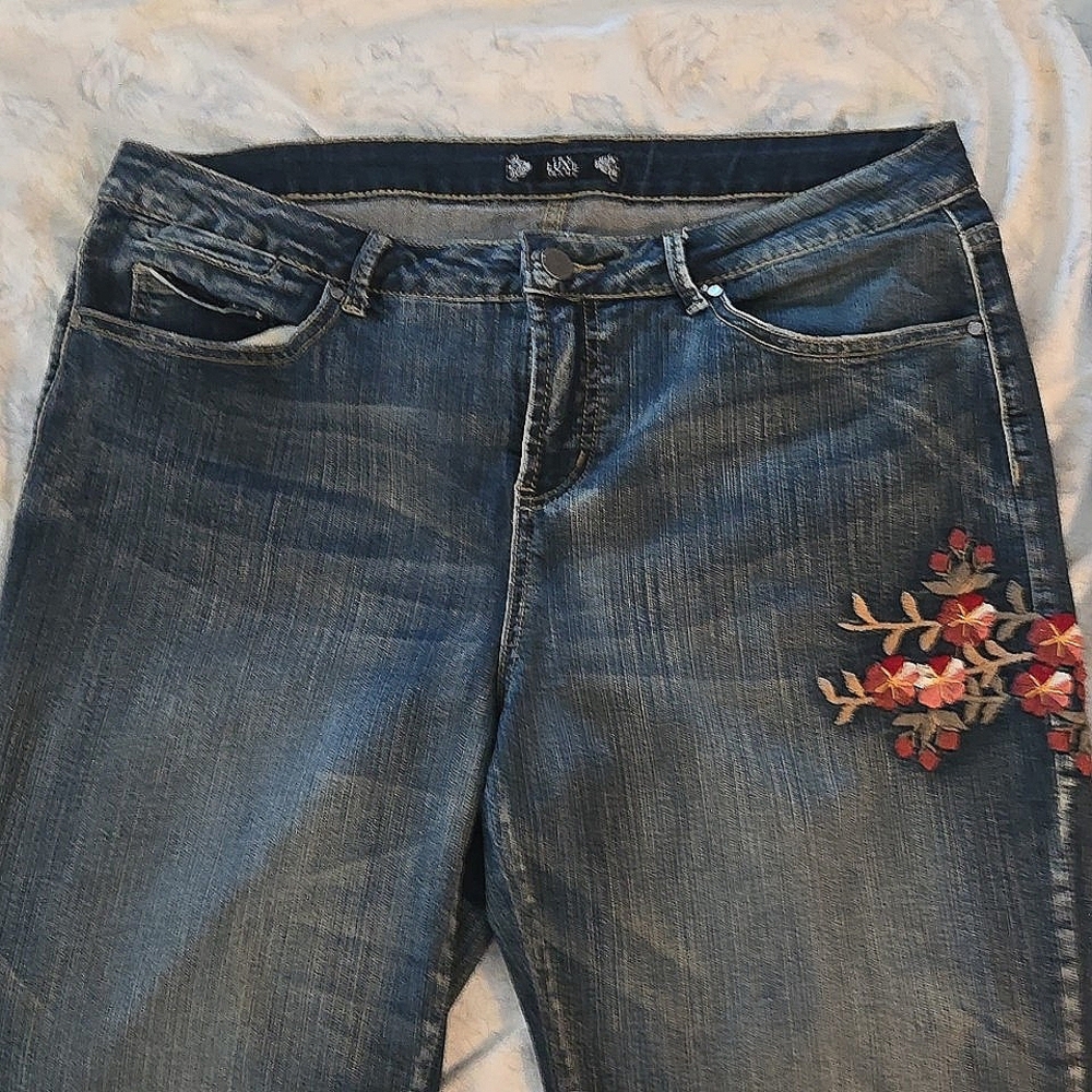 Floral embroidered and distressed jeans